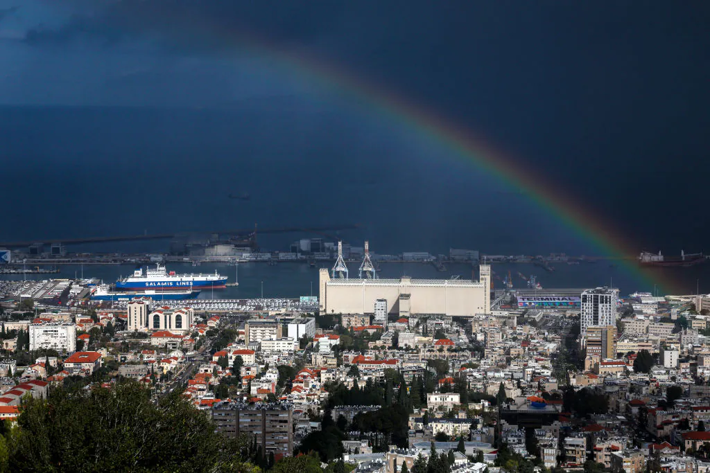 A rainbow forms over the port of Haifa in northern Israel on Nov. 26, 2024. (Ahmad Gharabli/AFP via Getty Images)