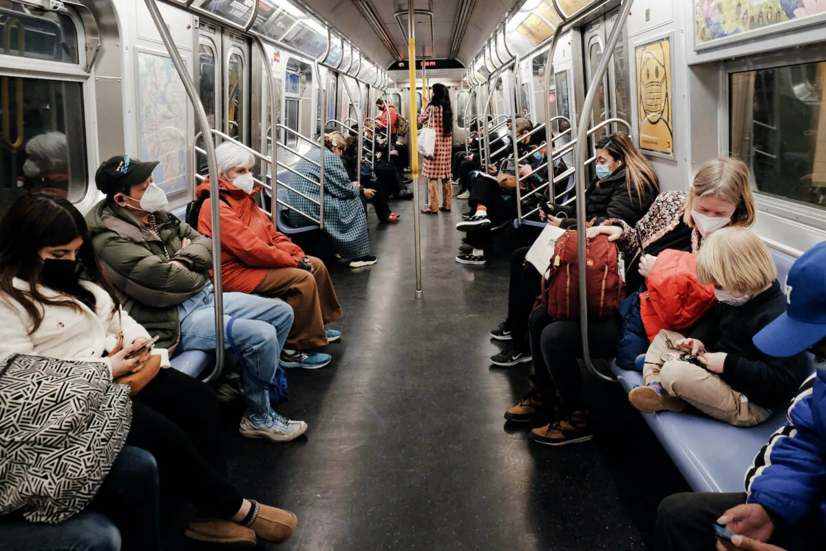 People ride on an MTA subway F train in New York City on March 11, 2022. (Spencer Platt/Getty Images)