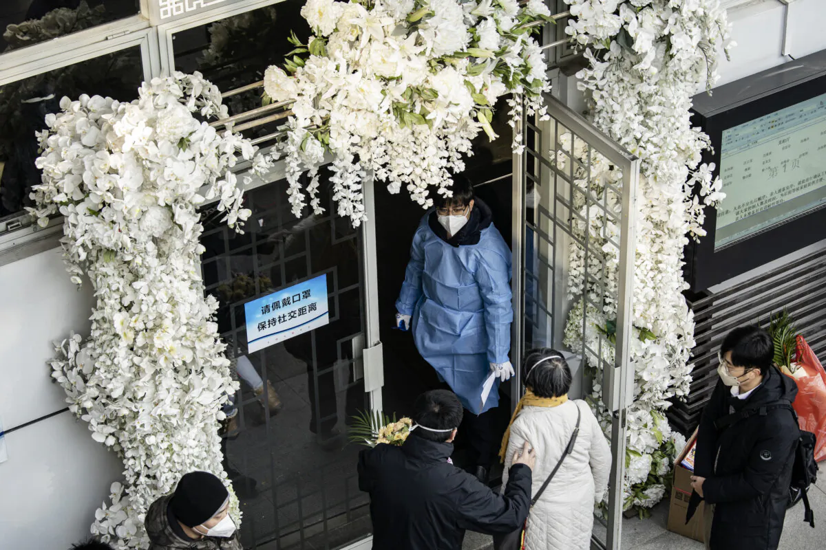 Mourners gather outside memorial halls for the deceased at a funeral home in Shanghai on Dec. 31, 2022. (Qilai Shen/Bloomberg via Getty Images)