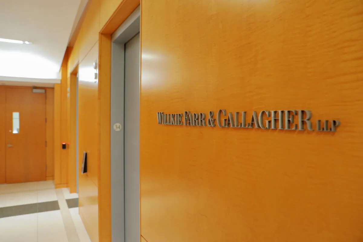 Signage is seen at the legal offices of the law firm Willkie Farr & Gallagher in New York City, on May 19, 2021. (Andrew Kelly/Reuters) 