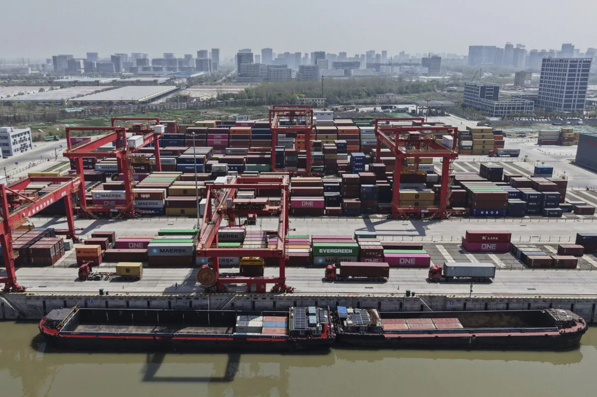 An aerial view of Xiasha Container Terminal on a canal in Hangzhou in east China's Zhejiang province on April 6, 2025. (Chinatopix Via AP)
