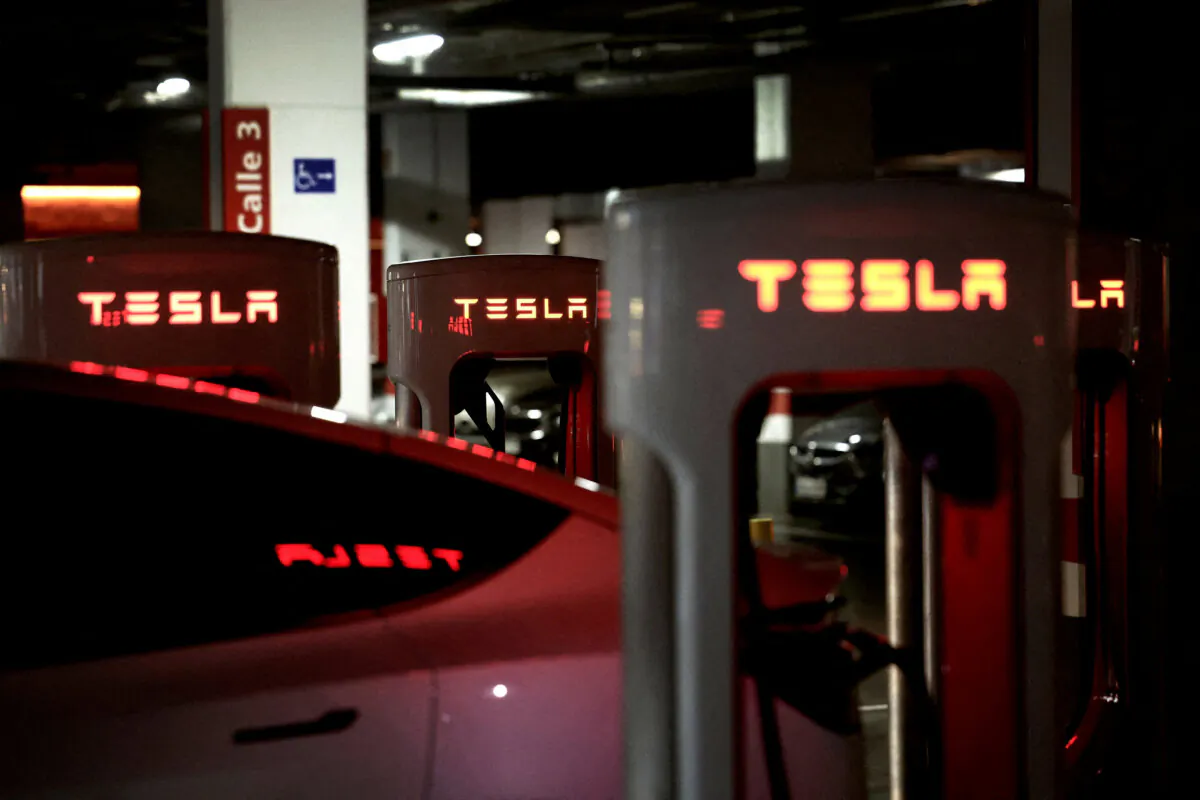 A Tesla electric vehicle is charging at a Tesla Supercharger battery charging station in Barakaldo, Spain, on March 29, 2025. (Vincent West/Reuters File Photo)