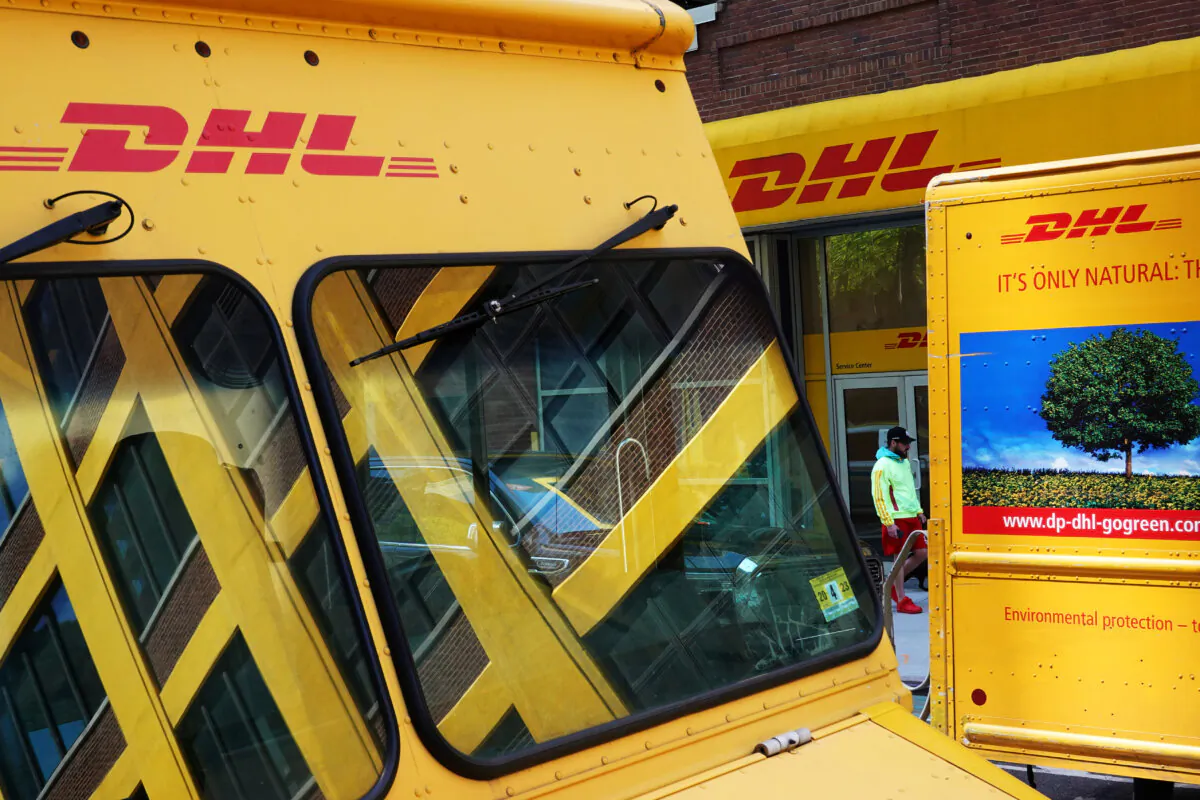 Trucks are parked outside a DHL delivery facility in New York on May 9, 2022. (Andrew Kelly/Reuters)