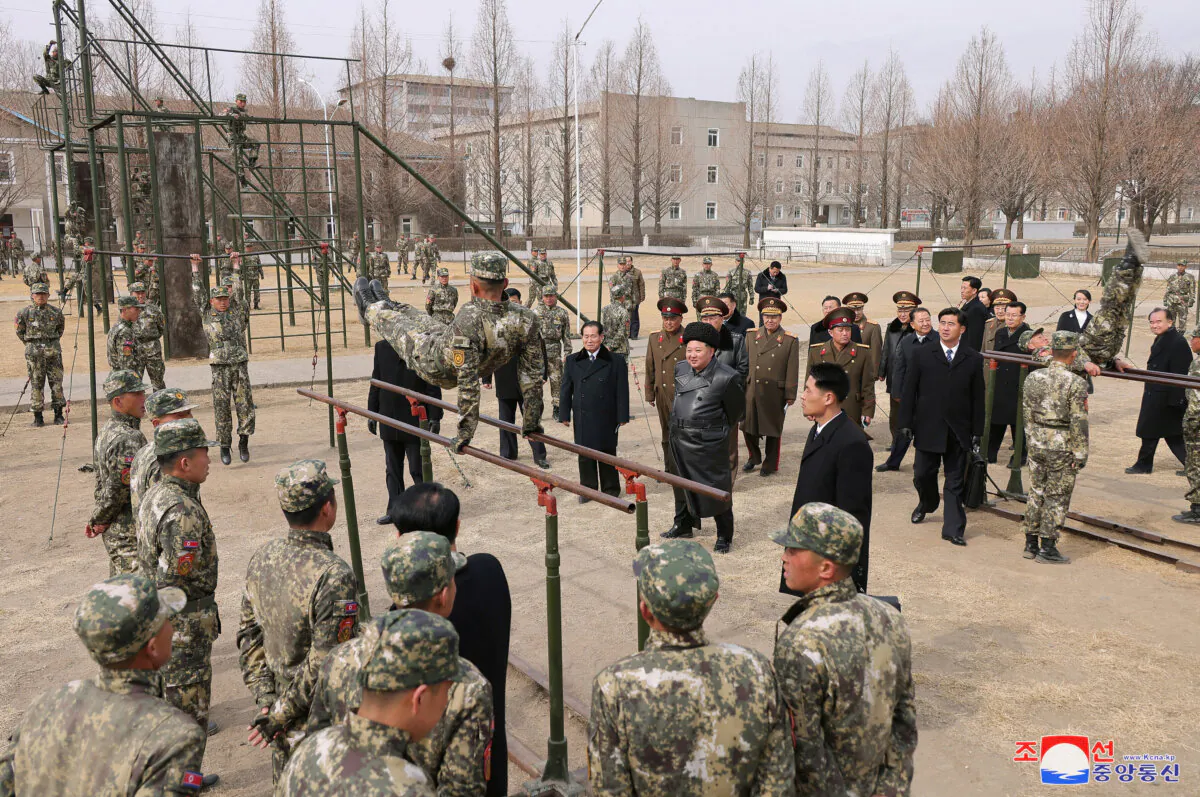 North Korean leader Kim Jong Un watches a cadet practicing on the parallel bars during his visit to the Kang Kon Military Academy, in Pyongyang, North Korea, on Feb. 25, 2025. (KCNA via Reuters)