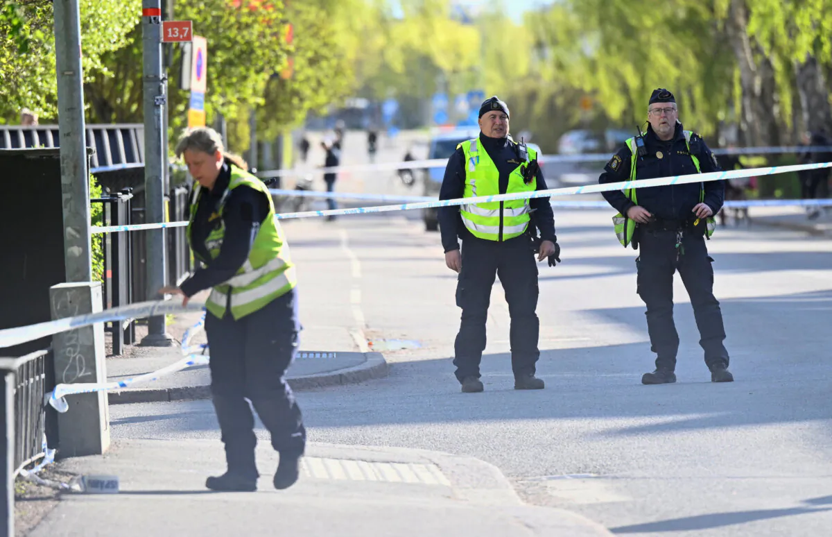 Police officers work onsite a day after a deadly shooting at Vaksala Square in Uppsala, Sweden, on April 30, 2025. (TT News Agency/Fredrik Sandberg via Reuters)