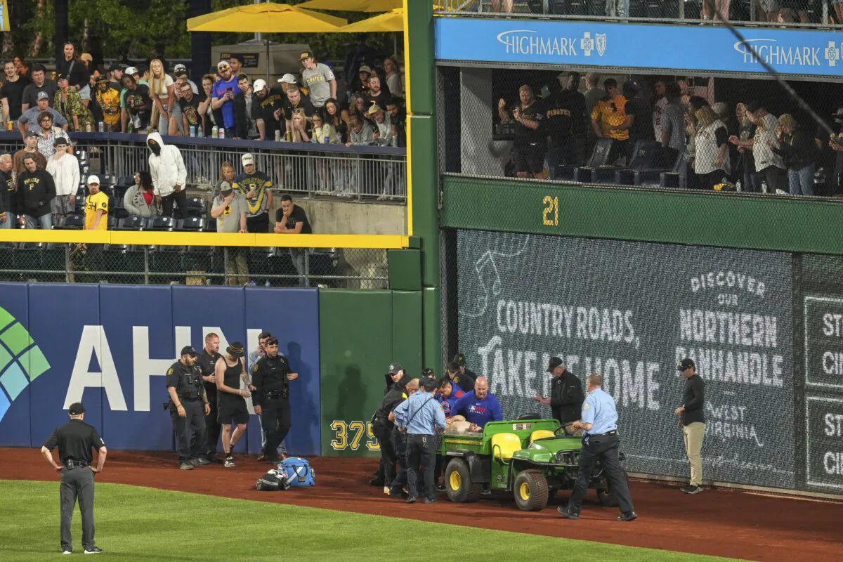A fan is carted off the field at PNC Park after falling out of the stands during the seventh inning of a baseball game between the Pittsburgh Pirates and the Chicago Cubs in Pittsburgh on April 30, 2025. (Gene J. Puskar/AP Photo)
