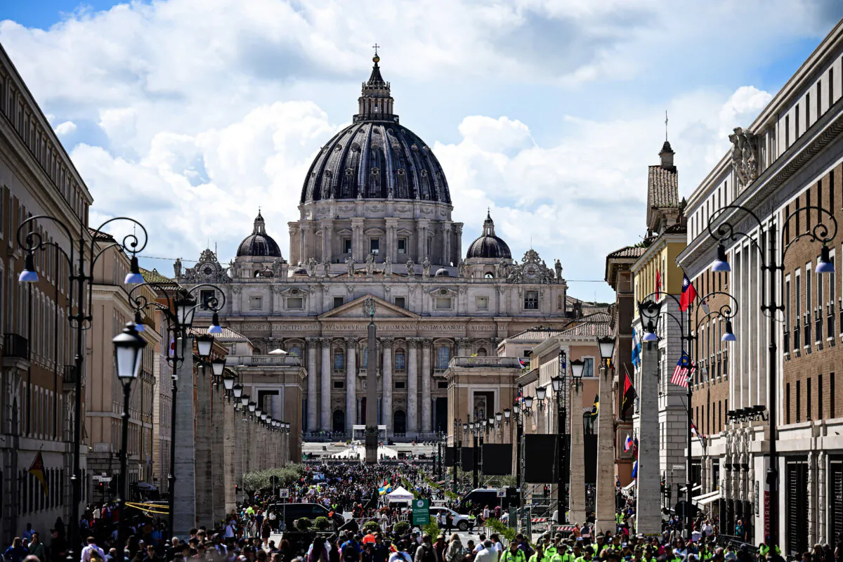Visitors walk on Via della Conciliazione street with a view of The Vatican's St Peter's Basilica, in Rome, on April 24, 2025. (Piero Cruciatti/AFP via Getty Images)