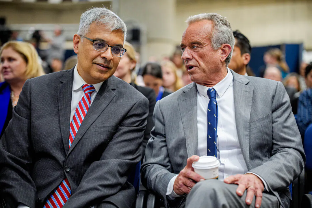 National Institutes of Health Director Dr. Jay Bhattacharya (L) and Health Secretary Robert F. Kennedy Jr. speak in Washington on April 22, 2025. (Andrew Harnik/Getty Images)