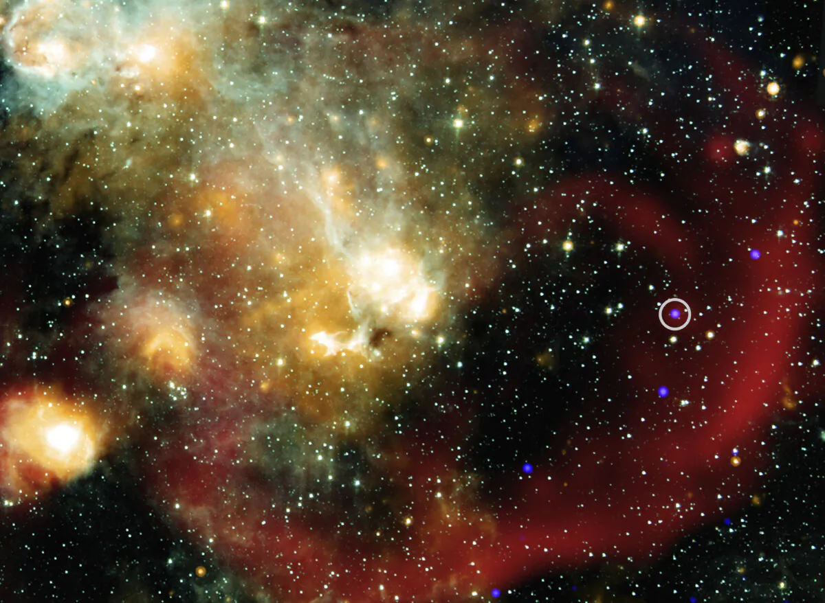 X-rays from NASA’s Chandra X-ray Observatory (represented in blue) that have been combined with infrared data from NASA’s retired Spitzer Space Telescope (cyan, light blue, teal and orange), and radio from MeerKat (red). An inset shows a more detailed view of the immediate area around this unusual object in X-ray and radio light. (NASA/Chandra/Spitzer/MeerKat via AP)