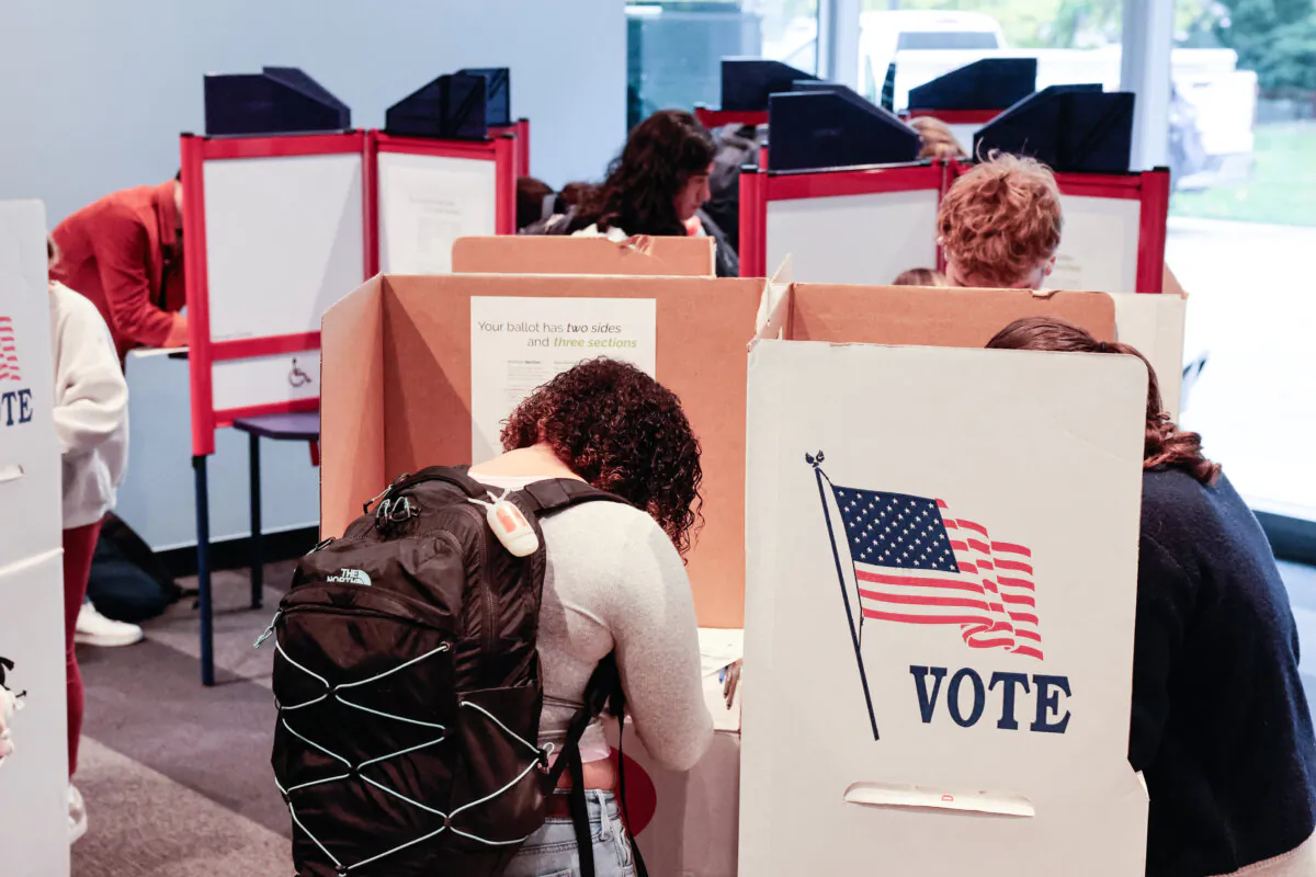 People cast ballots during early voting for the general election at the University of Michigan Museum of Art Gallery in Ann Arbor, Mich., on Oct. 31, 2024. (Jeff Kowalsky/AFP via Getty Images)