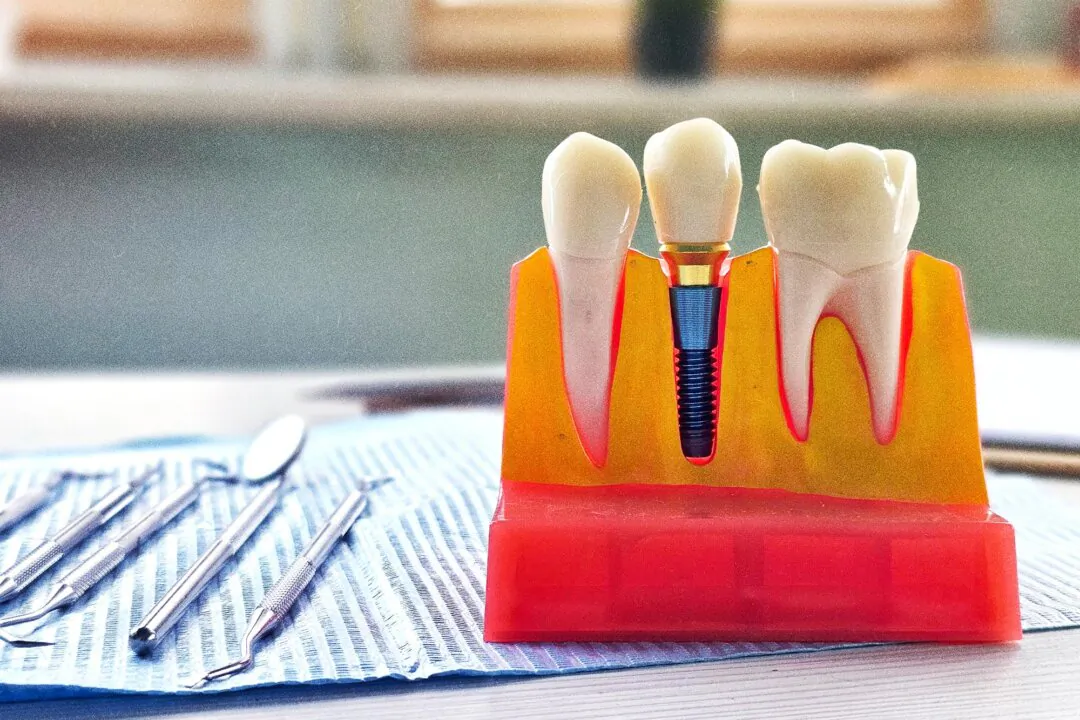 Failing to replace a missing tooth in a timely manner may lead to tooth misalignment, periodontal disease, or an improper bite. (PeopleImages.com - Yuri A/Shutterstock)