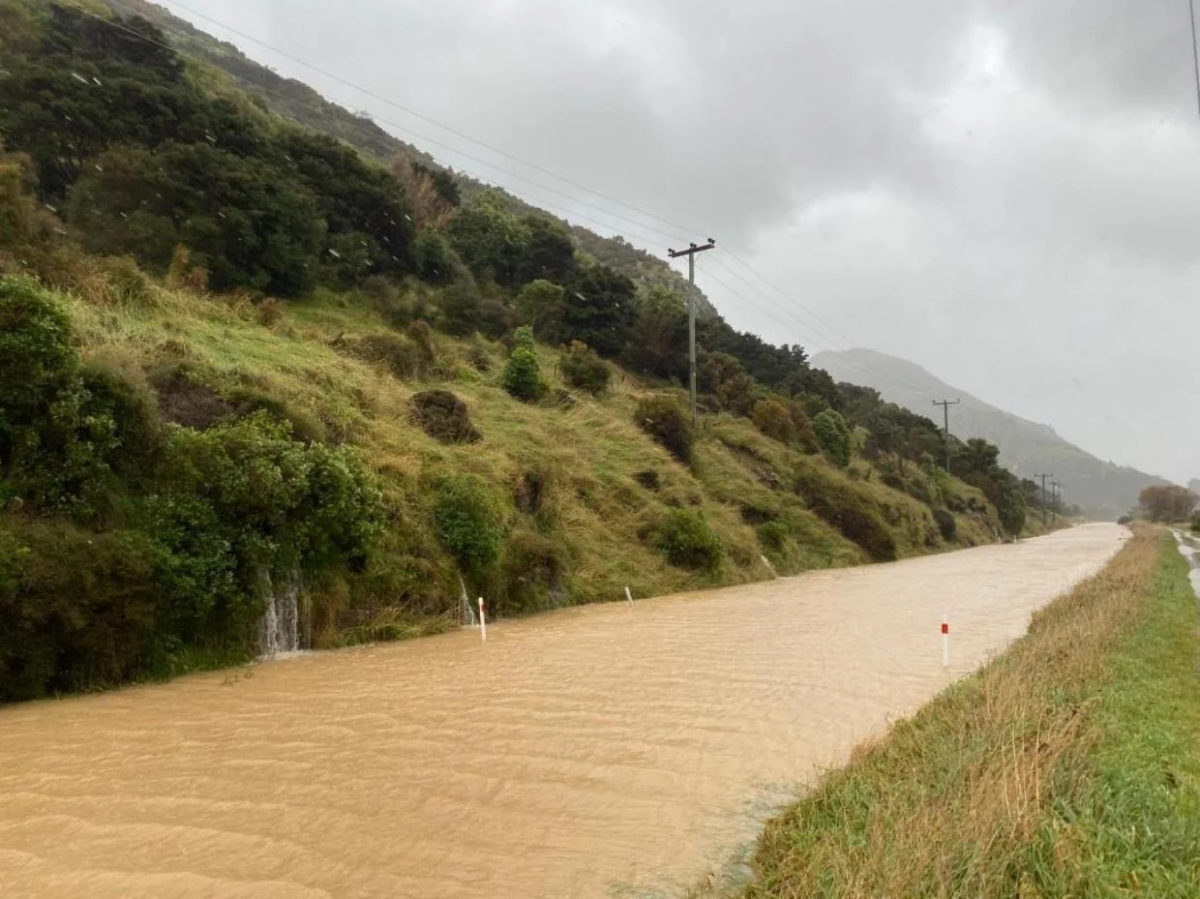 No longer a road, now a river: State Highway 57 in New Zealand's South Island at 2:00 pm on the afternooon of Thursays, May 1, 2025.