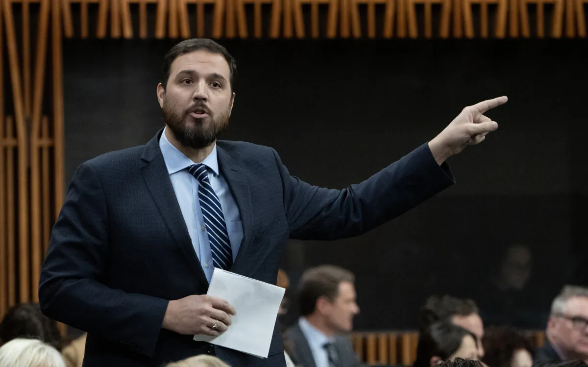 Conservative MP for Battle River-Crowfoot Damien Kurek rises during Question Period, in Ottawa, Dec. 14, 2023. (Adrian Wyld/The Canadian Press)