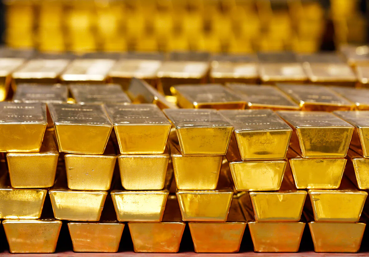 Gold bars are stacked in a vault at the U.S. Mint, in West Point, N.Y. (AP Photo/Mike Groll, File)
