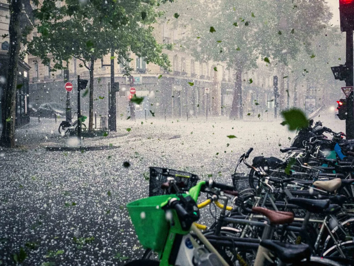 A street and bicycles during a hailstorm with rain and sleet in Paris on May 3, 2025. (Bastien Ohier/Hans Lucas/AFP via Getty Images)