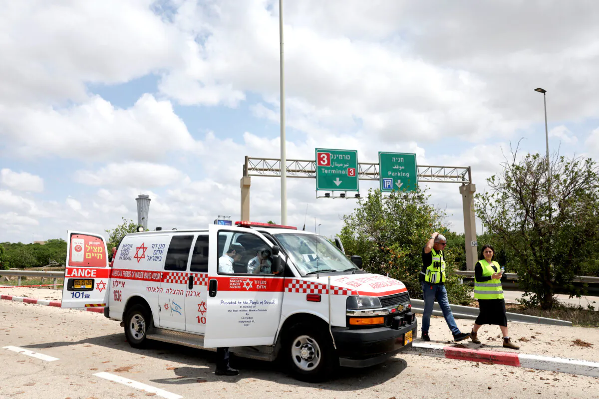 Emergency personnel work at the site of a missile attack, launched from Yemen, at the entrance of Ben Gurion Airport, in Tel Aviv, Israel, on May 4, 2025. (Nir Elias/Reuters)