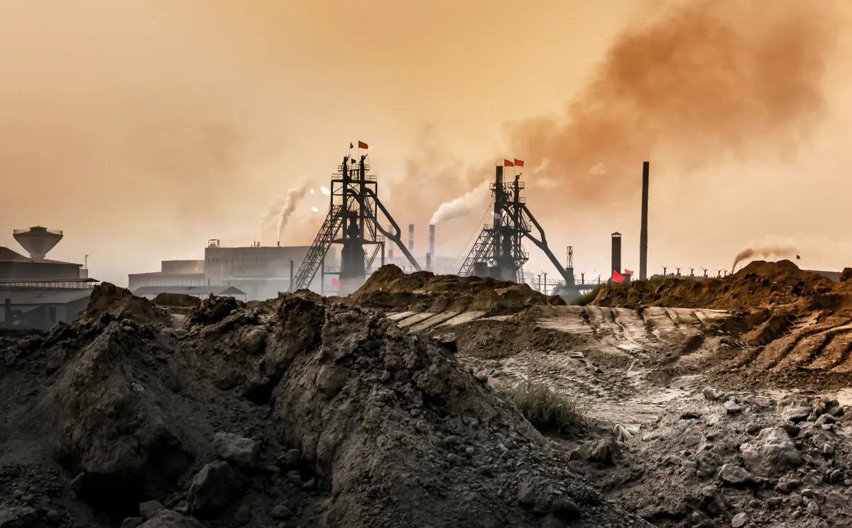 An industrial plant pollutes the air and produces hazardous waste in Baotou, Inner Mongolia, China, in this 2016 image. (ebenart/Shutterstock)