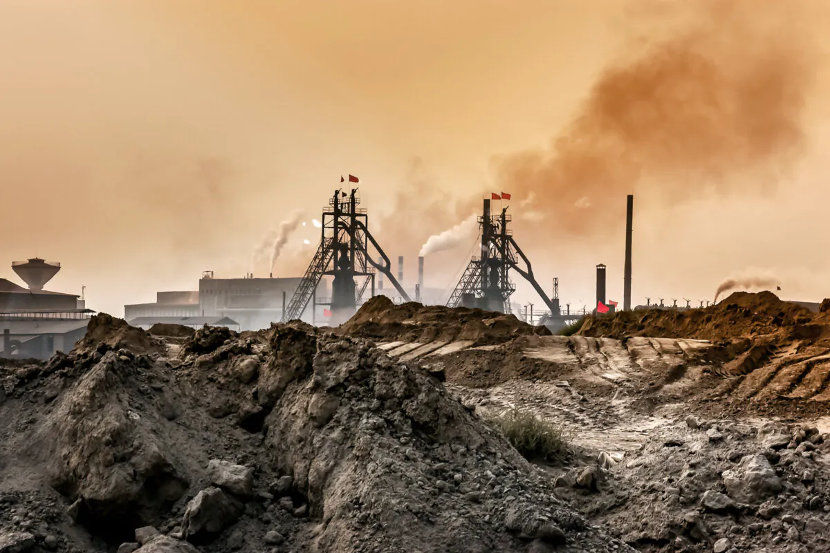 An industrial plant pollutes the air and produces hazardous waste in Baotou, Inner Mongolia, China, in this 2016 image. China, which controls more than 90 percent of global rare earth processing, tightened export controls on key rare earth elements in April, escalating its tariff standoff with Washington. (ebenart/Shutterstock)