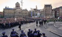 Day in Photos: War Commemoration, Attack on Kyiv, and a Mud Race