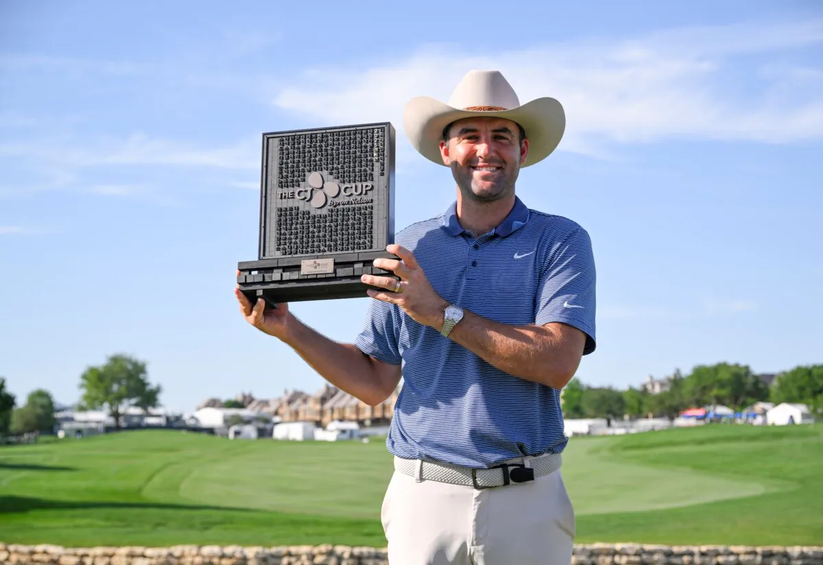 Scottie Scheffler of the United States poses with the winner's trophy after the final round of THE CJ CUP Byron Nelson 2025 at TPC Craig Ranch in McKinney, Texas, on May 4, 2025. (Orlando Ramirez/Getty Images for The CJ Cup)