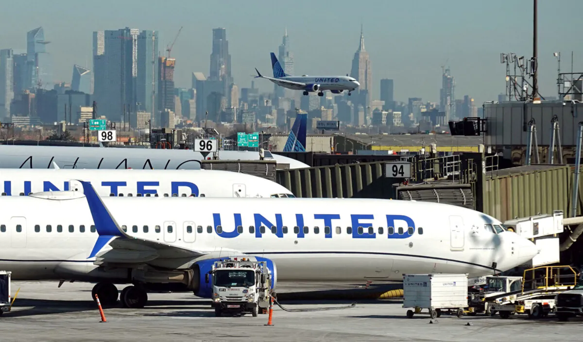 United Airlines planes land and prepare to take off at Newark Liberty International Airport in Newark, N.J., on Jan. 27, 2025. (Fabrizio Bensch/Reuters)