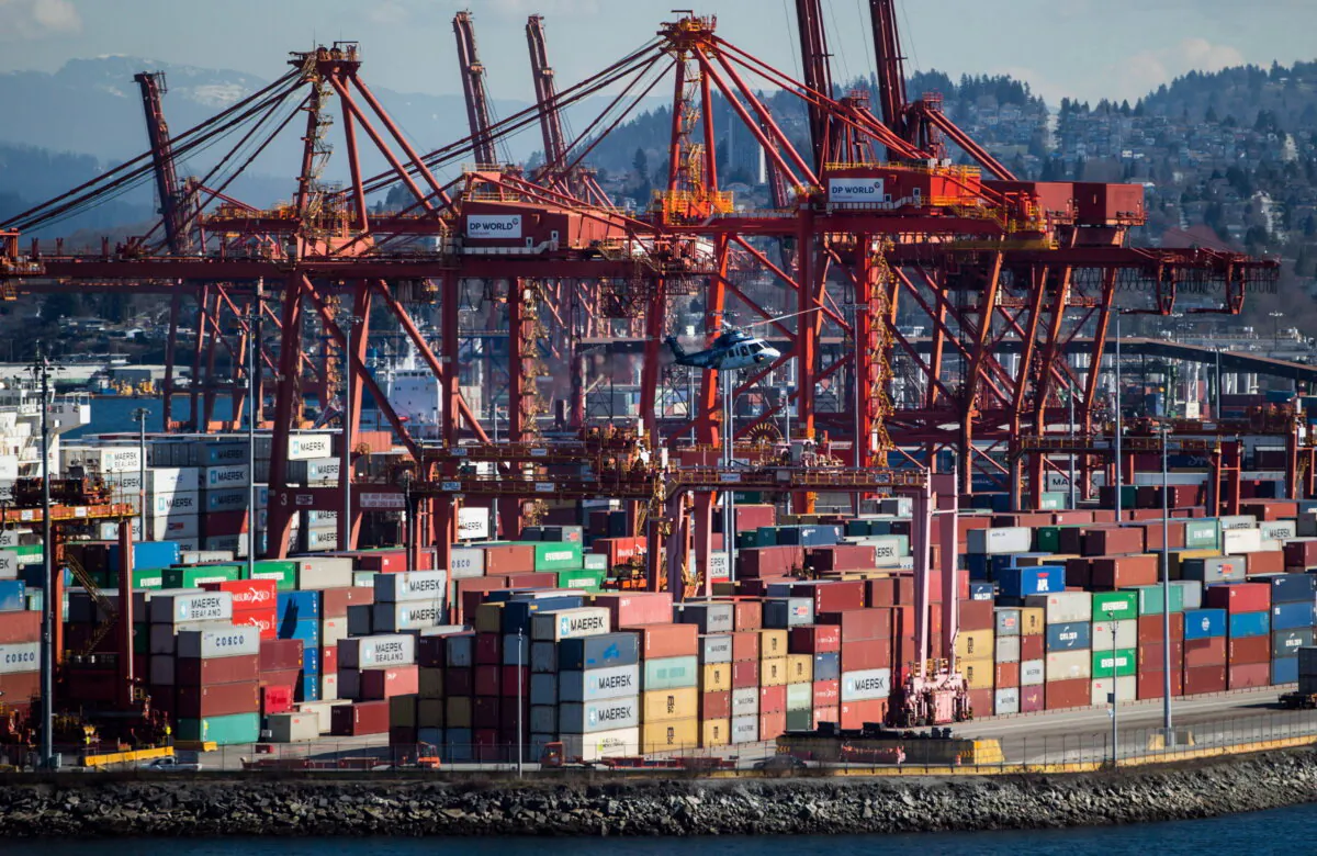 Cranes used to load and unload container ships are seen at the DP World marine terminal at Port Metro Vancouver, in Vancouver, on March 16, 2018. (The Canadian Press/Darryl Dyck) 
