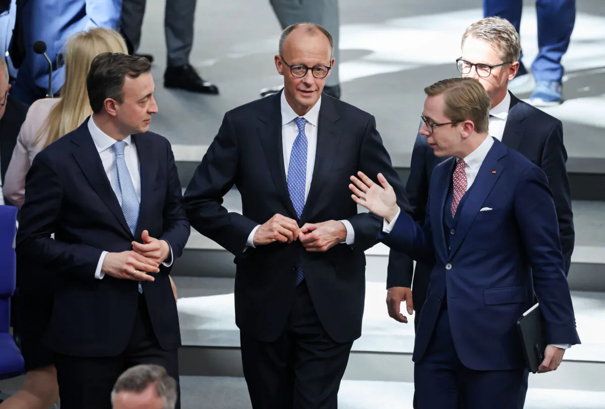 German Chancellor designate Friedrich Merz of the German Christian Democrats (CDU) is flanked by his colleague Philipp Amthor (R) as he returns for a second vote on his election at a special session of the Bundestag in Berlin, Germany, on May 6, 2025. (Sean Gallup/Getty Images)