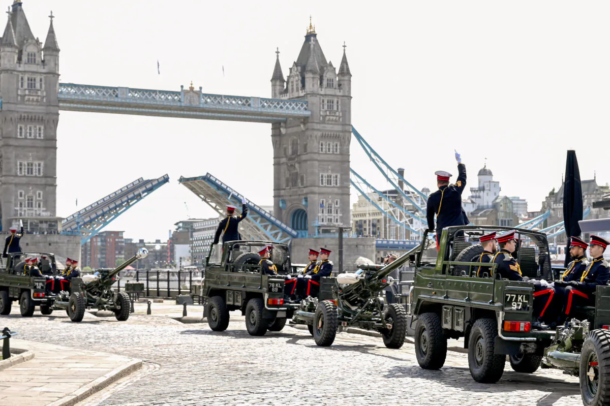 Members of the Honourable Artillery Company Regiment arrive ahead of a 62-gun royal salute at Tower Wharf in London on May 6, 2025. The British Army marks the anniversary of King Charles III's Coronation with traditional gun salutes. (Jeff Spicer/Getty Images)