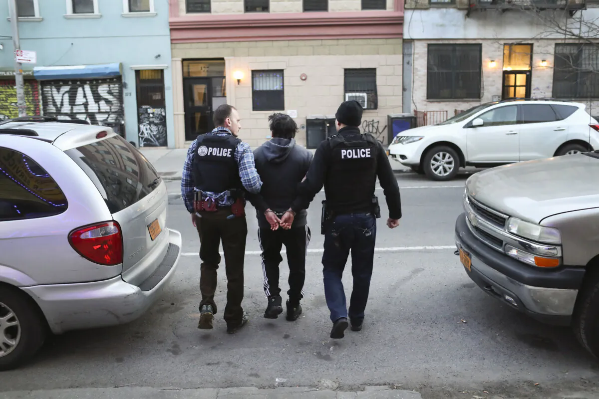 Immigration and Customs Enforcement officers arrest an illegal immigrant during an operation in the Bushwick neighborhood of Brooklyn in New York City on April 11, 2018. (John Moore/Getty Images)