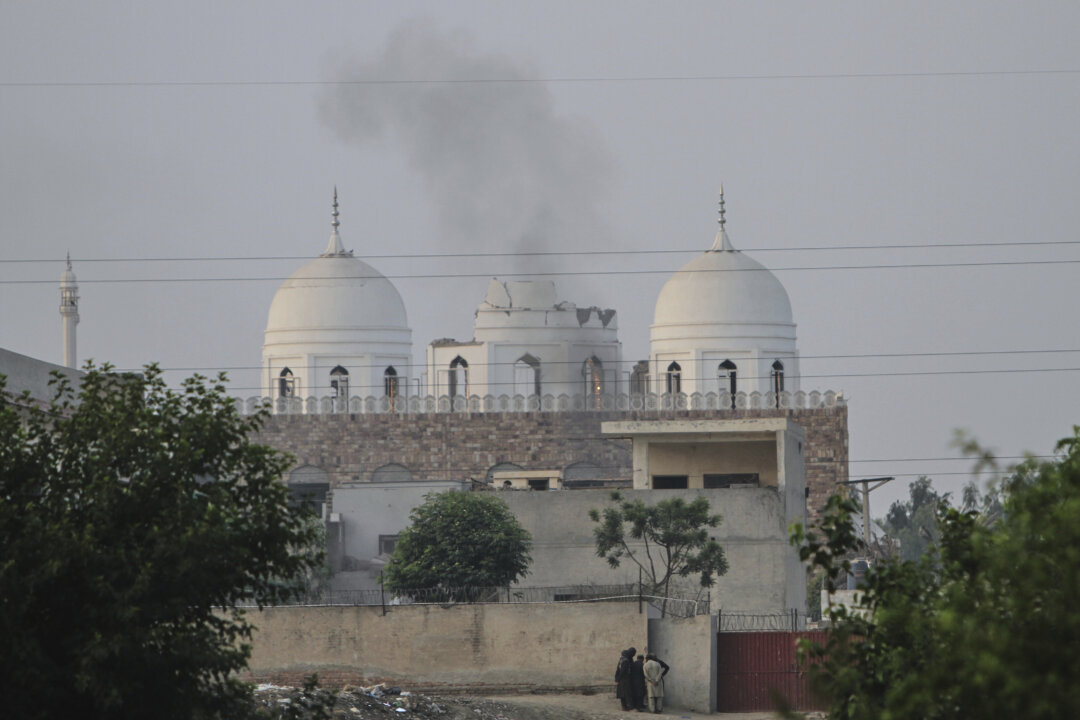 Pakistan Threatens to Respond After Indian Air Strikes Kill 26