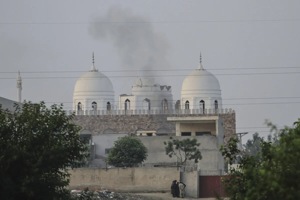 Local residents stand outside a mosque of an Islamic seminary partially damaged by a suspected Indian missile attack, on the outskirts of Bahawalpur, Pakistan, on May 7, 2025. (Asim Tanveer/AP)