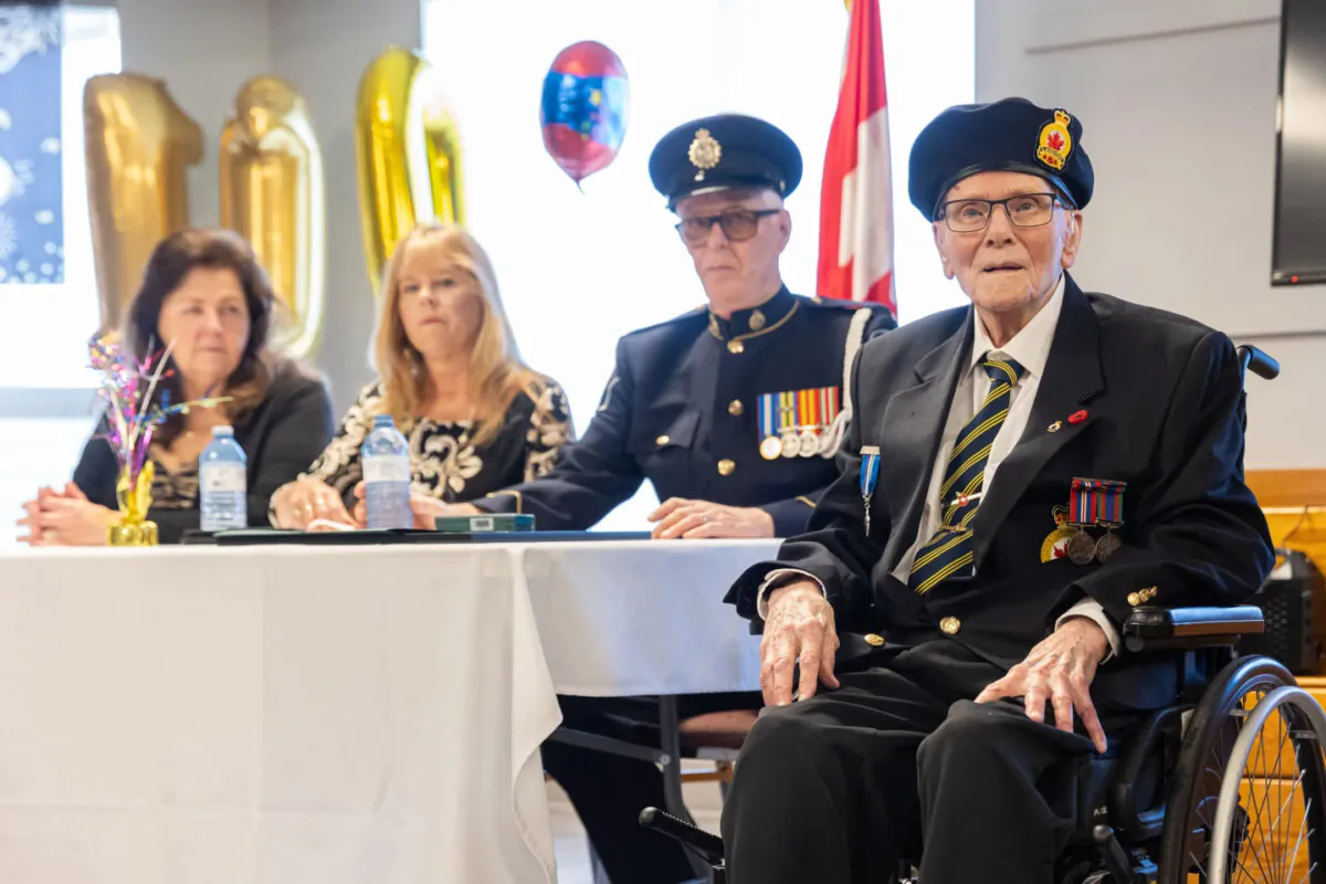 Burdett "Burd" Thomas Sisler (R), a 110-year-old-veteran who served during the Second World War, is seen at his birthday party at a Royal Canadian Legion in Fort Erie, Ont., in an April 13, 2025, handout photo. (The Canadian Press/HO-Alex Heidbuechel)