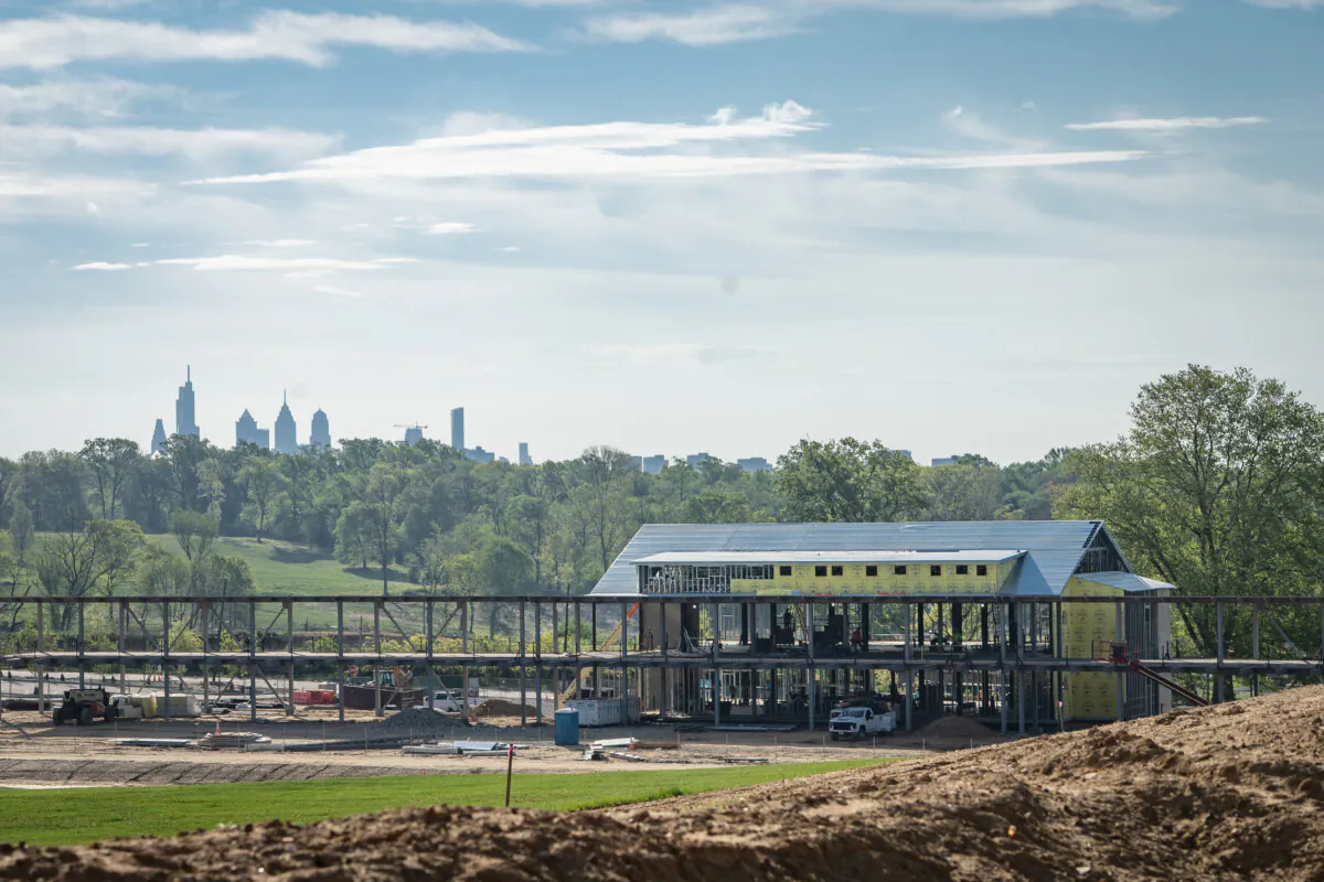 Two-story golf driving range at Cobbs Creek with Center City Philadelphia in the backdrop. (Courtesy of Cobbs Creek Foundation)