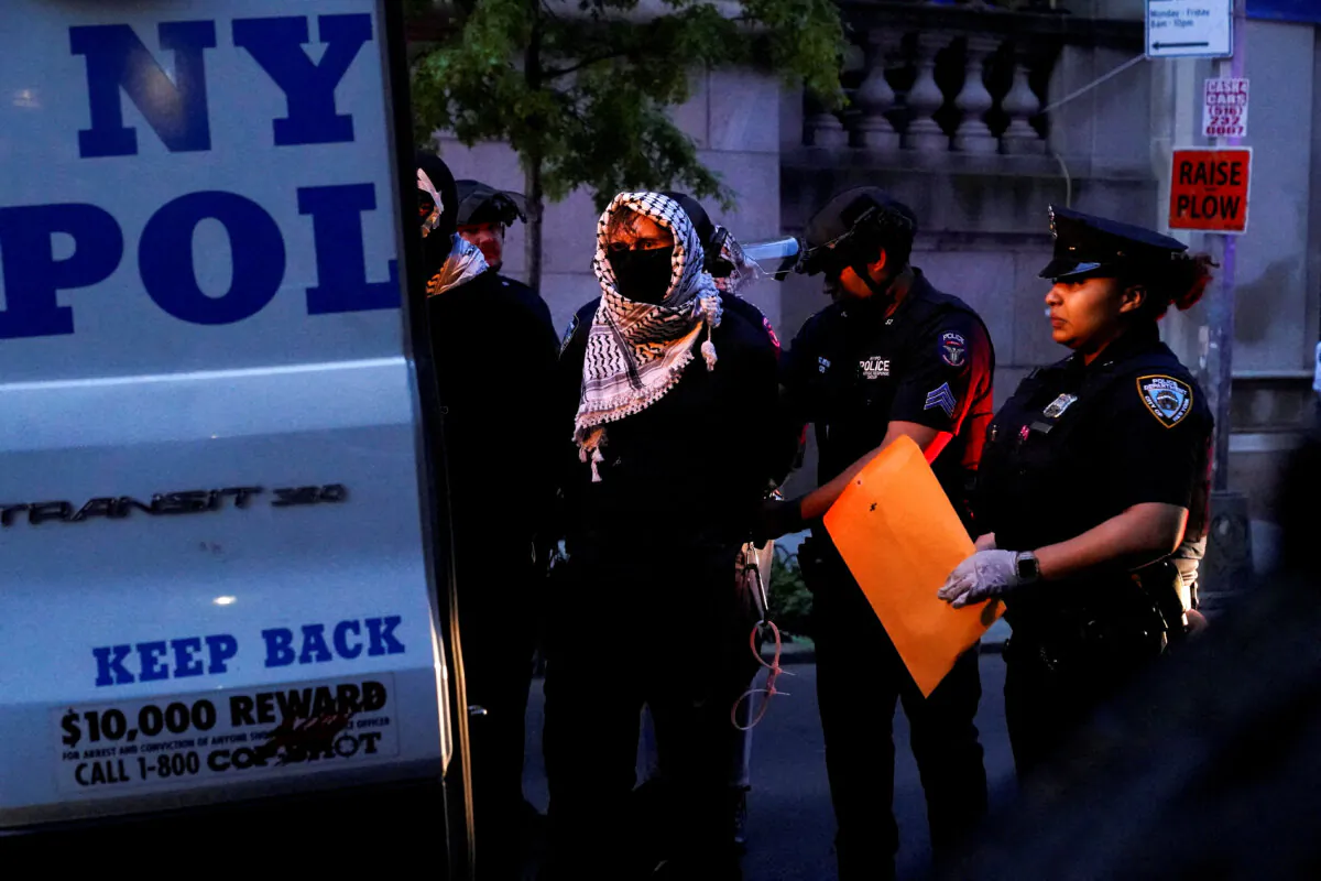 Pro-Palestinian protesters are loaded into NYPD buses after being detained by public safety officers, following a protest at Butler Library on the campus of Columbia University in New York on May 7, 2025. (Ryan Murphy/Reuters)