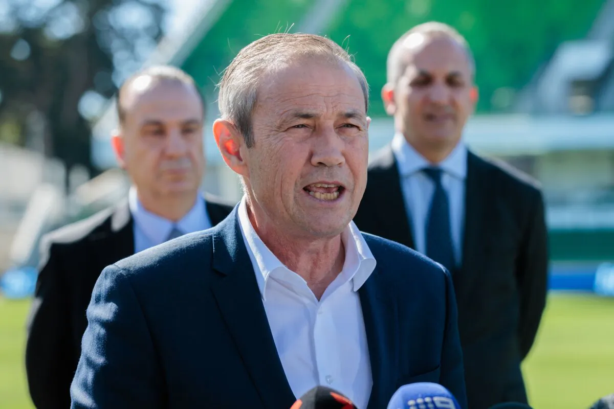 WA Premier Roger Cook speaks as Australian Rugby League Commission Chairman Peter V’landys and National Rugby League CEO Andrew Abdo look on during a press conference about the forming of a new National Rugby League team the Perth Bears at HBF Park in Perth, Australia on May 8, 2025. (AAP Image/Richard Wainwright)