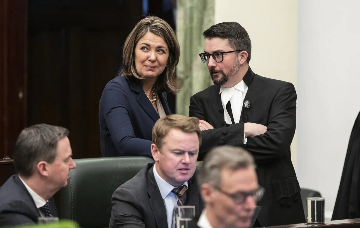 Alberta Premier Danielle Smith chats with Speaker of the House Nathan Cooper before the 2023 budget, in Edmonton on Feb. 28, 2023. (THE CANADIAN PRESS/Jason Franson)