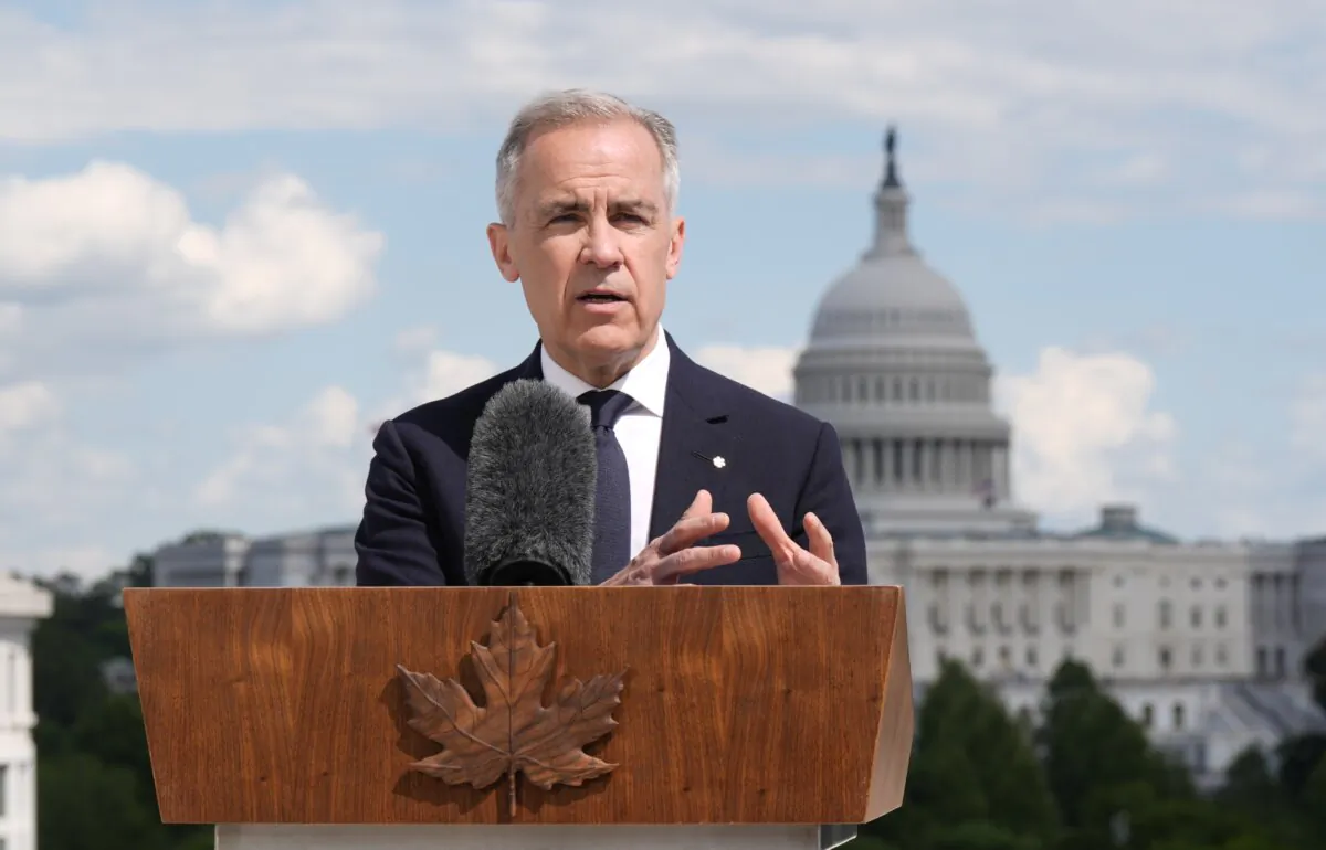 Prime Minister Mark Carney speaks with reporters during an availability at the Canadian Embassy in Washington on May 6, 2025. (The Canadian Press/Adrian Wyld) 