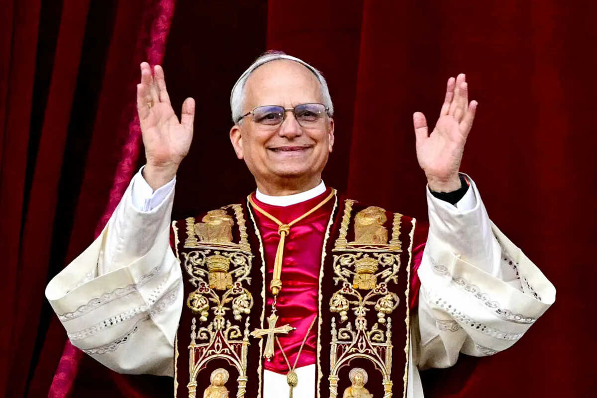 Newly elected Pope Leo XIV, Robert Prevost, appears on the central loggia balcony of St. Peter's Basilica for the first time after the cardinals concluded the conclave in the Vatican on May 8, 2025. (Tiziana Fabi/AFP via Getty Images)