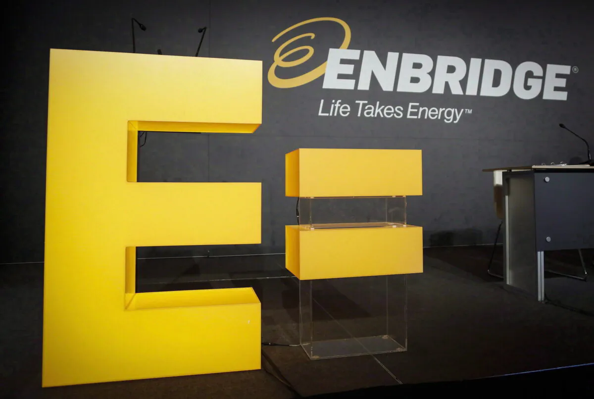 Enbridge company logos are seen at the company's annual meeting in Calgary, on May 12, 2016. (The Canadian Press/Jeff McIntosh)