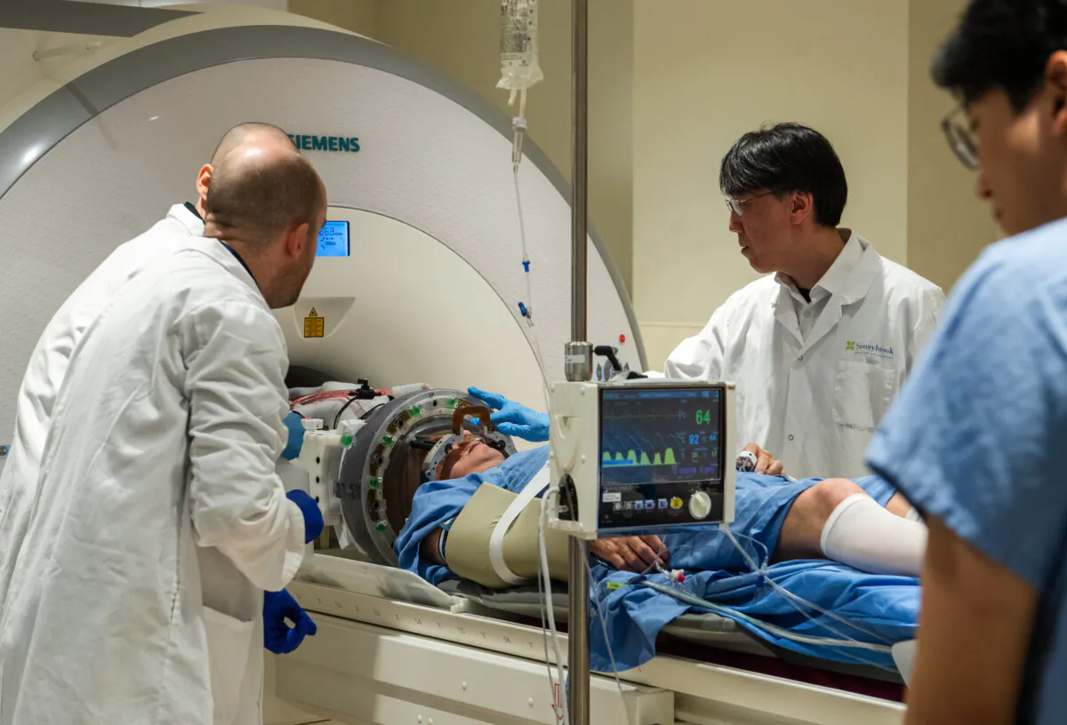 A focused ultrasound helmet is attached to an MRI scanner as part of an early-stage clinical trial exploring the delivery of immunoglobulin to the brain of a patient with ALS at Sunnybrook Health Sciences Centre in Toronto on May 7, 2025. (Laura Proctor/The Canadian Press) 