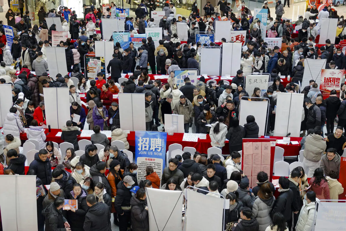 People gather at a spring job fair following a week-long Lunar New Year national holiday in Yantai, in Shandong Province, China, on Feb. 6, 2025. (AFP via Getty Images)