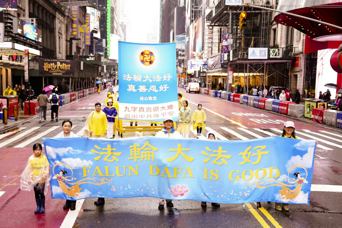 Falun Gong practitioners take part in a parade to celebrate World Falun Dafa Day and call for an end of the persecution in China, in New York City on May 9, 2025. (Larry Dye/The Epoch Times)