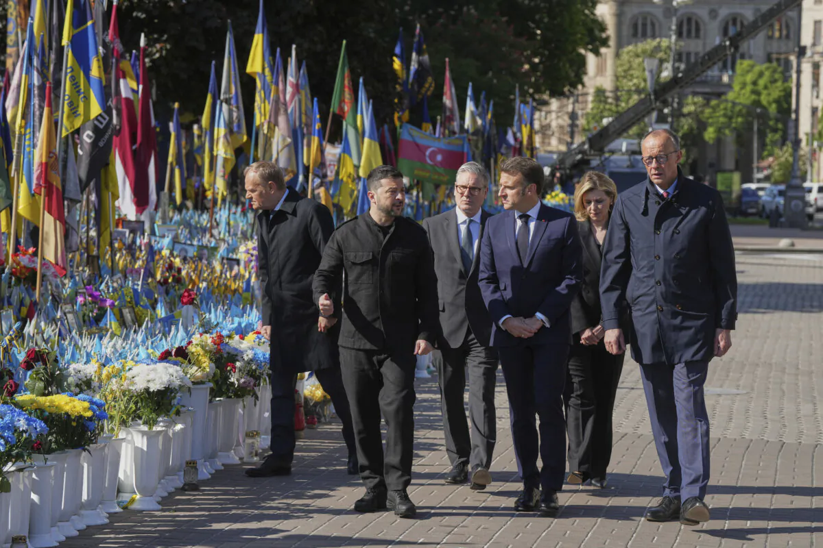 (L-R) Polish Prime Minister Donald Tusk, Ukrainian President Volodymyr Zelenskyy, UK Prime Minister Keir Starmer, French President Emmanuel Macron, German Chancellor Friedrich Merz arrive to put flowers on memorial of fallen Ukrainian soldiers at independence square in Kyiv, Ukraine, on May 10, 2025. (Evgeniy Maloletka /AP Photo)