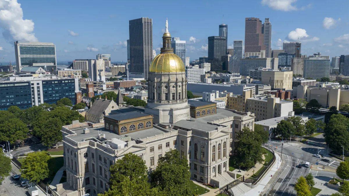 The gold dome of the Georgia Capitol gleams in the sun, in front of the skyline of downtown Atlanta on Aug. 27, 2022. (Steve Helber/AP Photo)