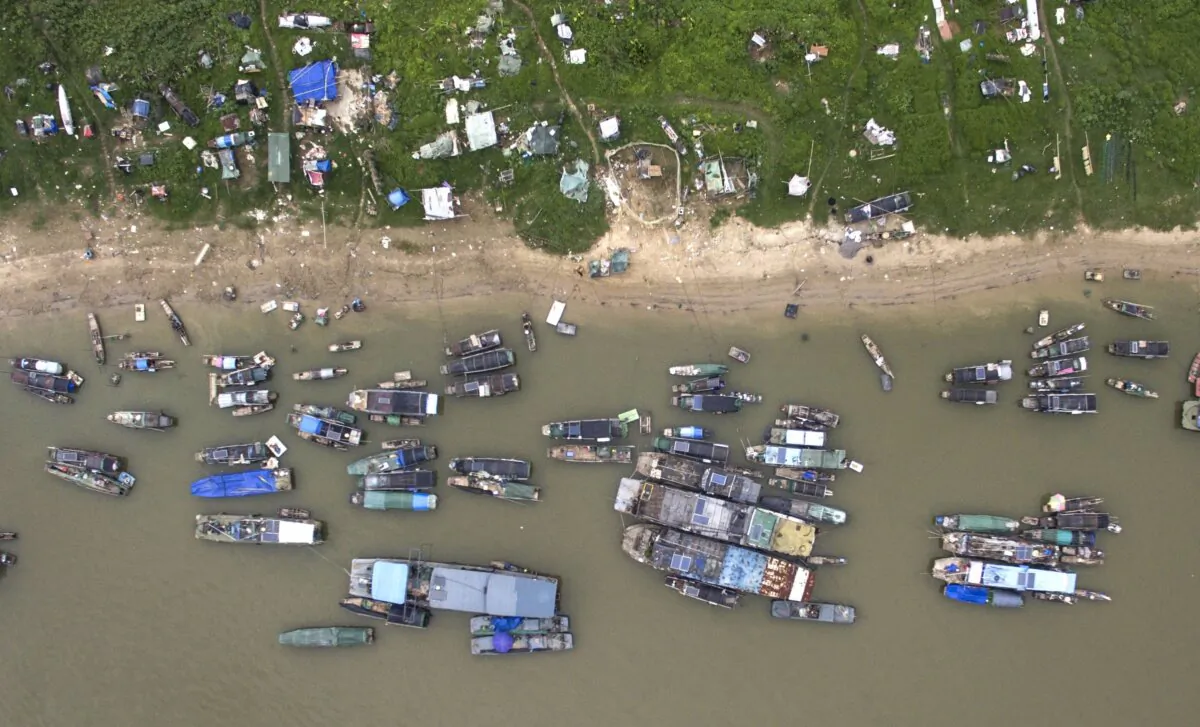 An aerial view of boats from the Tanka community moored on a river bank in Datang, in southern China's Guangdong province, on Sept. 8, 2017. (Fred Dufour/AFP via Getty Images)