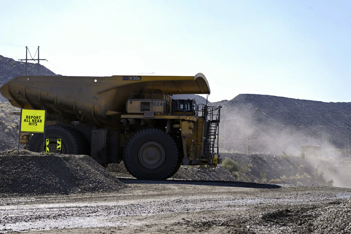 A truck carries ore at the open pit of a diamond mine in Jwaneng, Botswana, on May 11, 2023. (Monirul Bhuiyan/AFP via Getty Images)