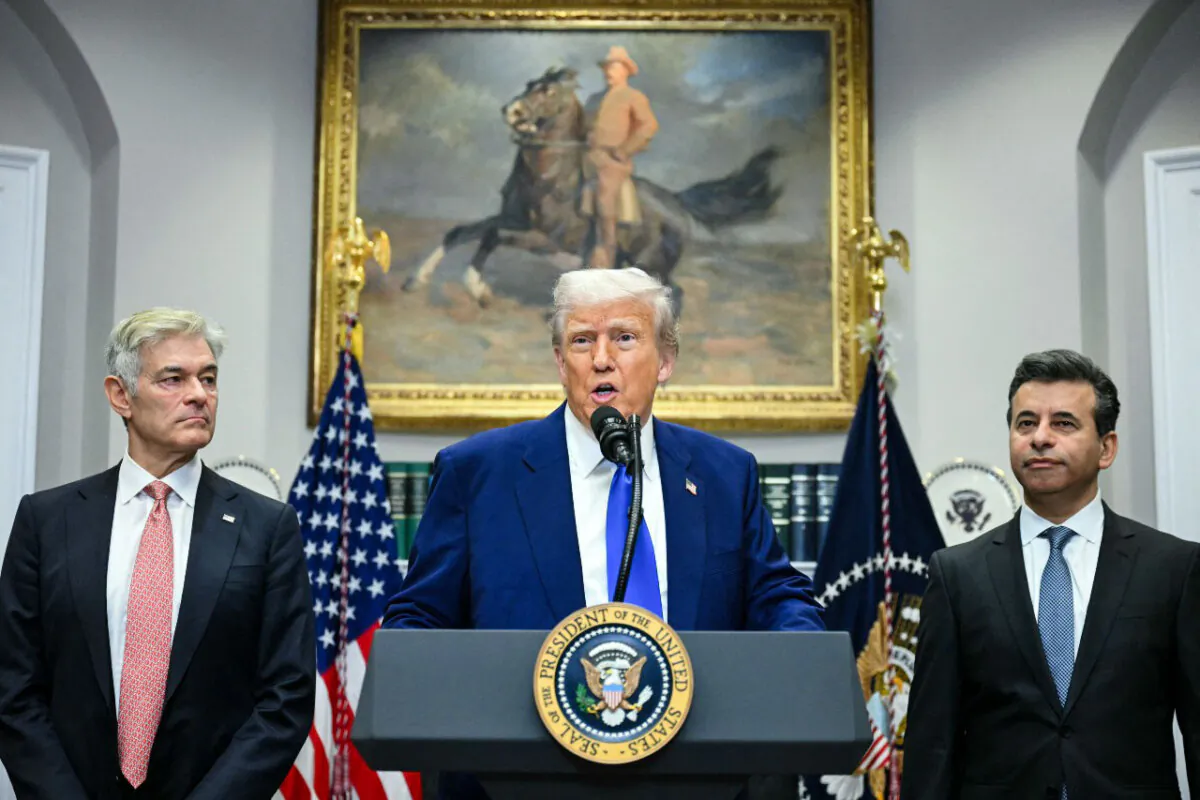 President Donald Trump speaks alongside Medicare and Medicaid Administrator Mehmet Oz (L) and Food and Drug Administration Commissioner Martin Makary (R) during a news conference about prescription drug prices, in the White House on May 12, 2025. (Jim Watson/AFP via Getty Images)