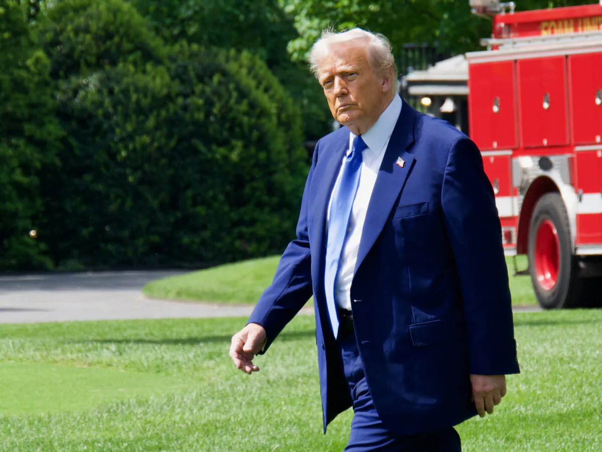 President Donald Trump walks toward Marine One as he departs the White House on his way to the Middle East on May 12, 2025. (Travis Gillmore/The Epoch Times)