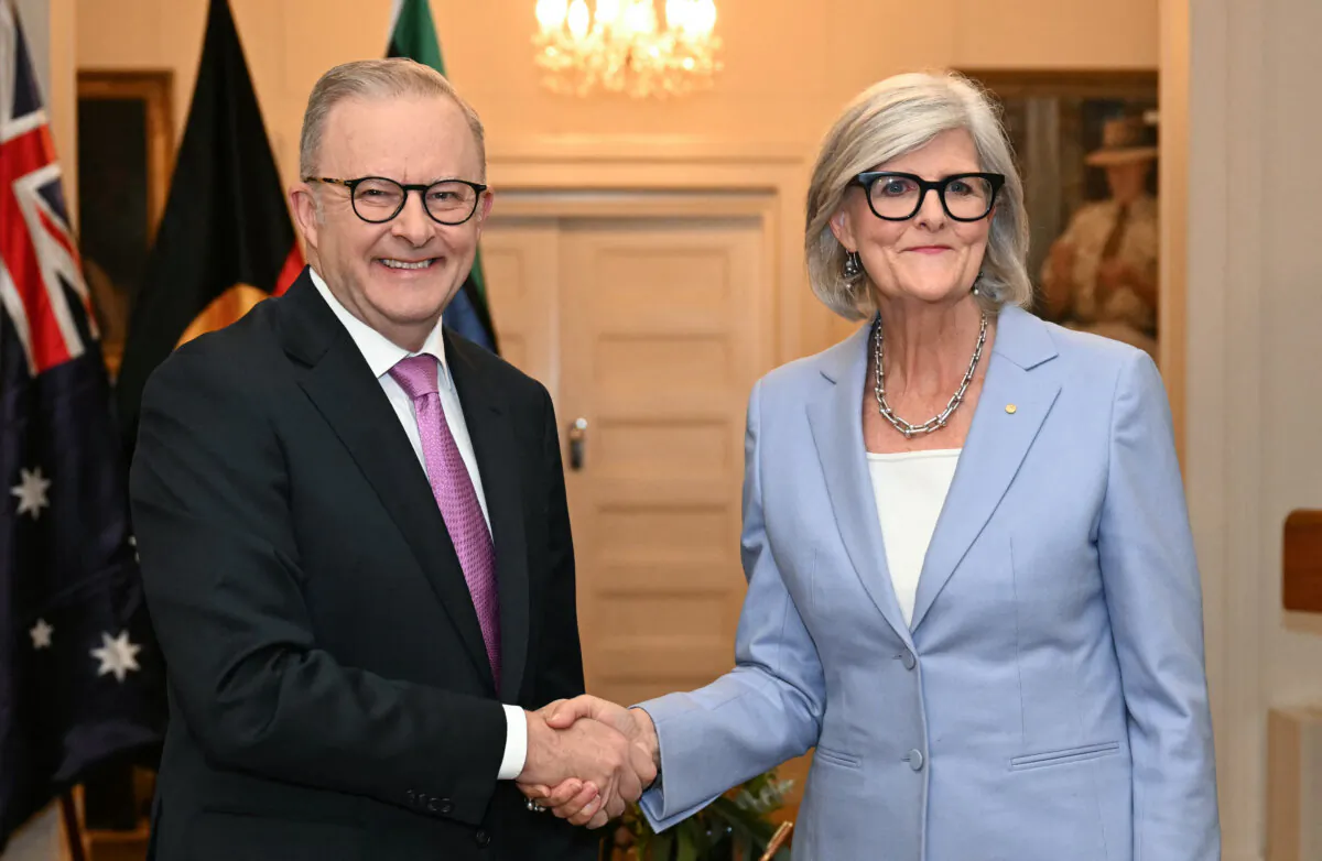 Australia's re-elected Prime Minister Anthony Albanese (L) shakes hands with Governor General Sam Mostyn (R) after taking his oath at Government House in Canberra, Australia on May 13, 2025. (Saeed Khan/AFP via Getty Images)
