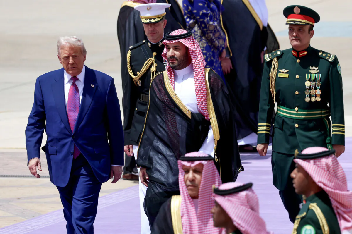 U.S. President Donald Trump (L) is greeted by Saudi Crown Prince Mohammed bin Salman as he arrives at King Khalid International Airport in Riyadh, Saudi Arabia, on May 13, 2025. (Win McNamee/Getty Images)